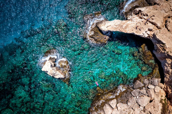 Natural rock arch along the coast of Ayia Napa. Overhead view. Famagusta district. Cyprus