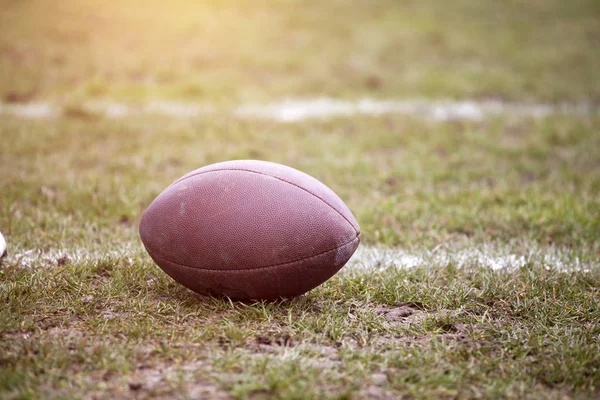 Close up of an american football on the field