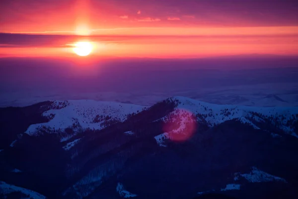 Beautiful sunrise in winter mountains of Transylvania