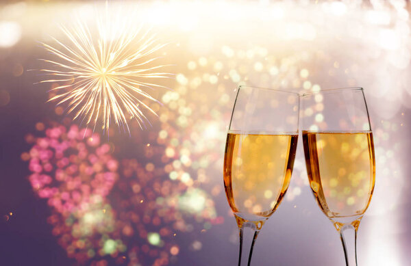Champagne glasses on sparkling background