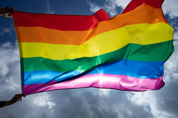 Colorful LGBT flag blows in the breez. — Stock Photo, Image