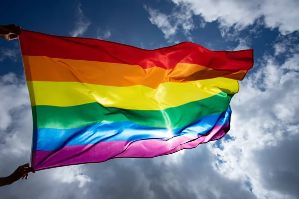 Colorful LGBT flag blows in the breez. — Stock Photo, Image