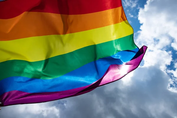 Colorful LGBT flag blows in the breez. — Stock Photo, Image