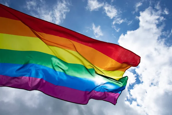 Colorful LGBT flag blows in the breez. — Stock Photo, Image