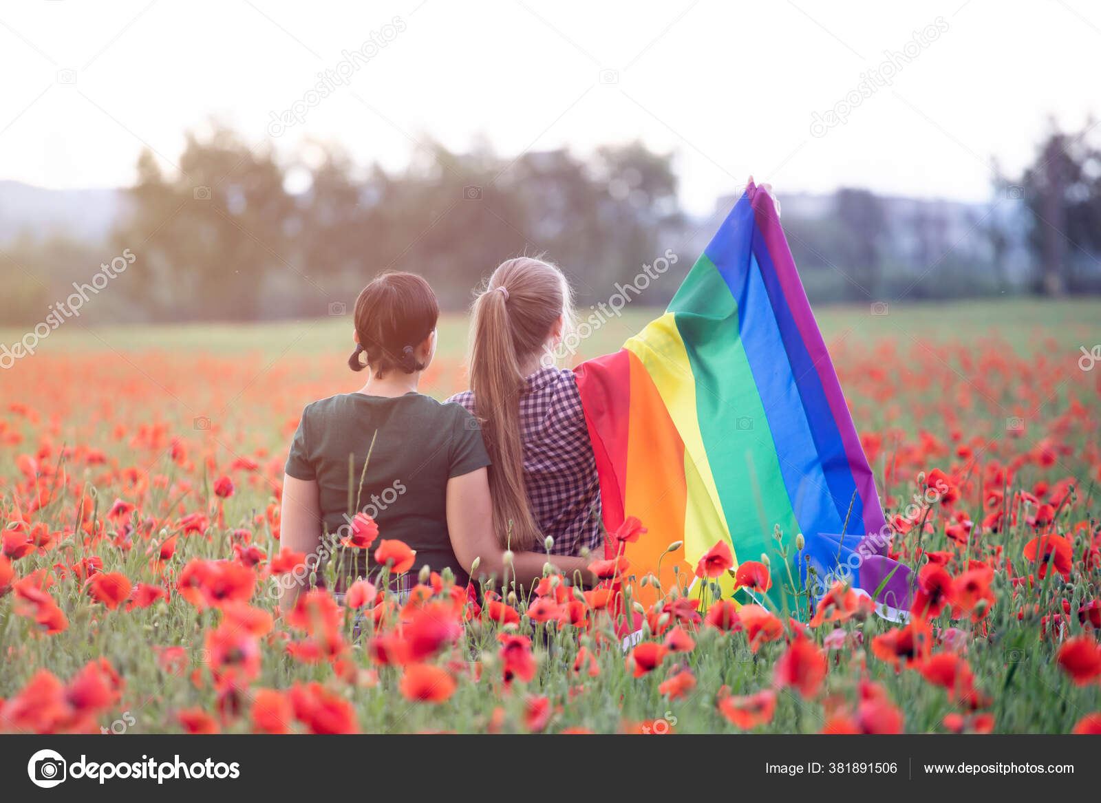 Lesbian Couple Hugging Holding Gay Rainbow Flag Beautiful Poppy Field Stock Photo by ©erika8213 381891506