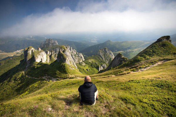 Lonely traveler in Ciucas mountains, Romania. Most scenic mountain from the Carpathians.