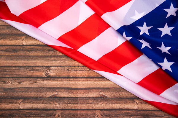 American flag on old wooden board.