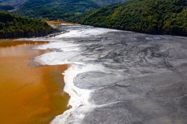 Flooded and abandoned village in the middle of a lake contaminated with cyanide at Geamana, near Rosia Montana, Romania