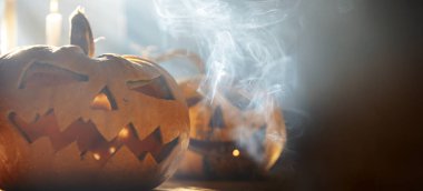 Scary Halloween background with Jack'o'lanterns, Halloween pumpkins glowing in the nigh