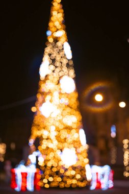 Defocused gold abstract Christmas tree outdoor