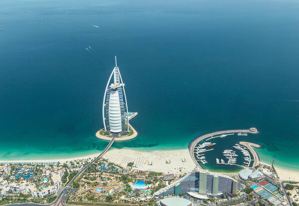 DUBAI, UAE - MAY 28: Burj Al Arab hotel on May 28, 2018 in Dubai, UAE. Burj Al Arab is a luxury unofficial 7star hotel built on an artificial island in front of Jumeirah beach. View from hydroplane.