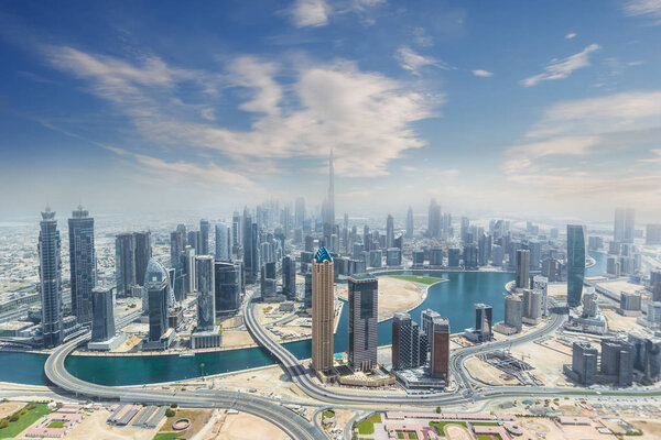 Aerial view of modern city skyscrapers in Dubai, UAE.
