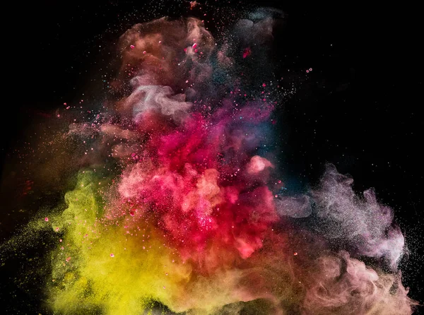 Farbiges Pulver Explosion isoliert auf schwarzem Hintergrund. — Stockfoto