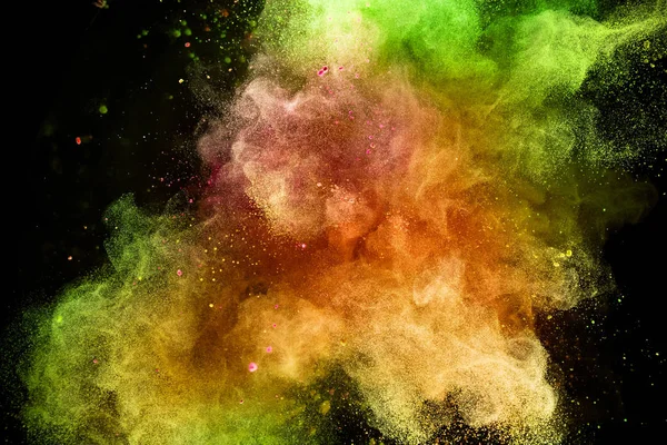 Esplosione di polvere colorata isolata su sfondo nero . — Foto Stock