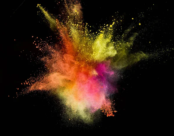 Explosión de polvo de color aislado sobre fondo negro . — Foto de Stock