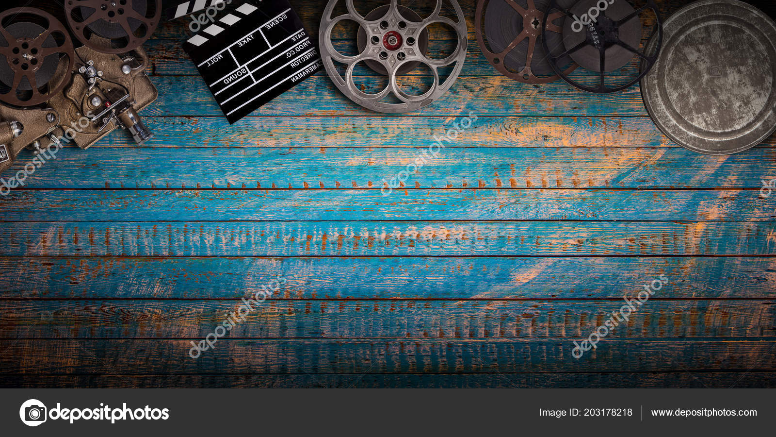 Cinema concept of vintage film reels, clapperboard and projector