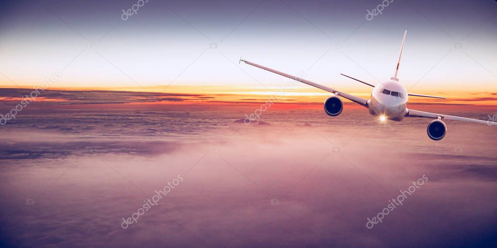 Commercial airplane flying above clouds.