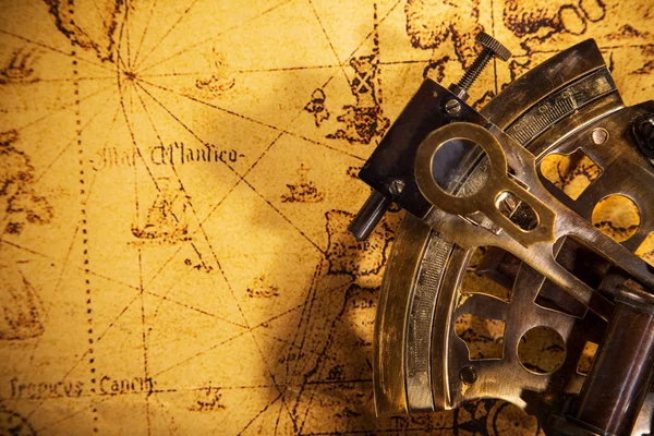 Old vintage navigation equipment on old world map. — Stock Photo, Image