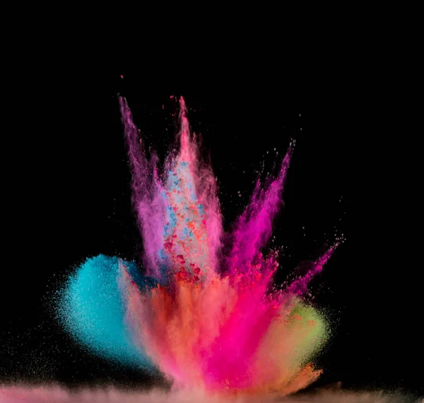 Explosión de polvo de color sobre fondo negro. —  Fotos de Stock