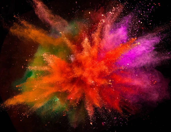 Gekleurde poeder explosie op zwarte achtergrond. — Stockfoto