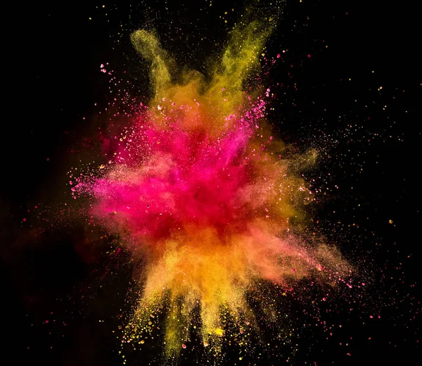 Explosión de polvo de color sobre fondo negro. — Foto de Stock