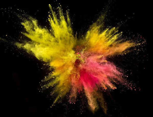 Explosión de polvo de color sobre fondo negro. — Foto de Stock