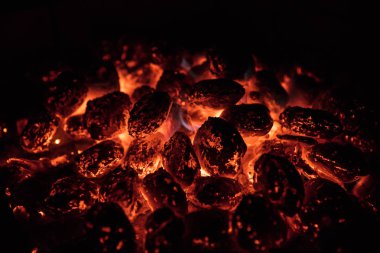 Glowing Hot Charcoal Briquettes on garden grill, close-Up, clipart