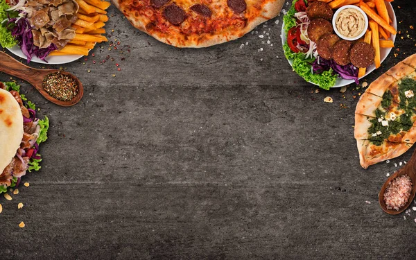 Top down view on traditional turkish meals on black stone table. — Stock Photo, Image