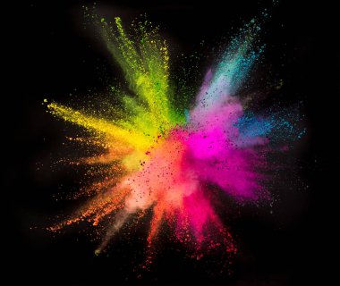 Colored powder explosion on black background. Freeze motion. clipart
