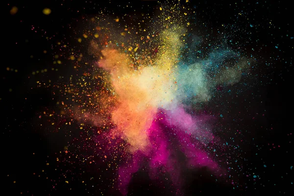 Colored powder explosion on black background. — Stock Photo, Image