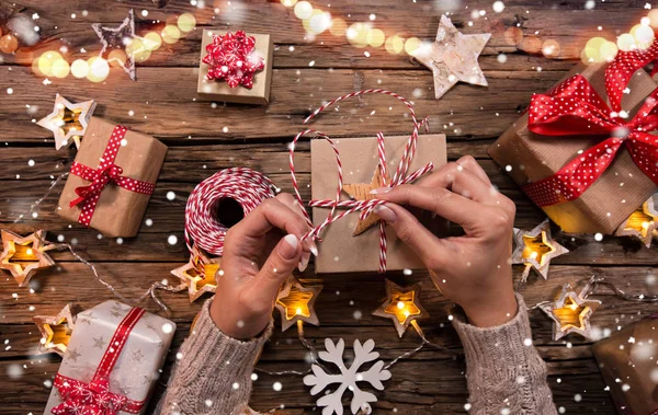 Top view of woman hands with gift box. — Stock Photo, Image