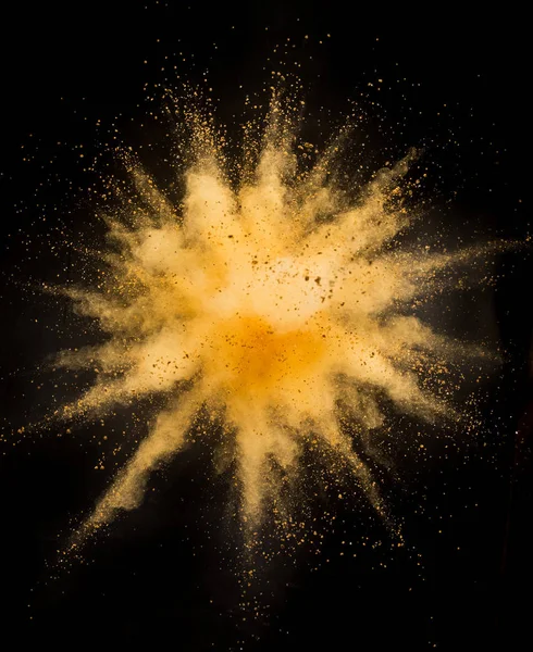 Zlatý prášek exploze na černém pozadí. — Stock fotografie
