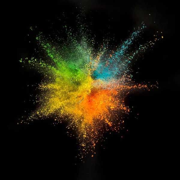 Colored powder explosion on black background. — Stock Photo, Image