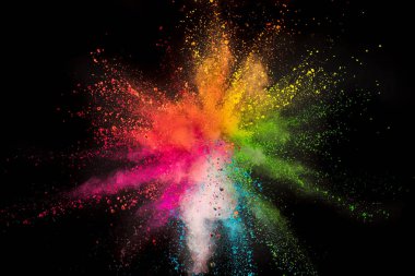Colored powder explosion on black background. clipart
