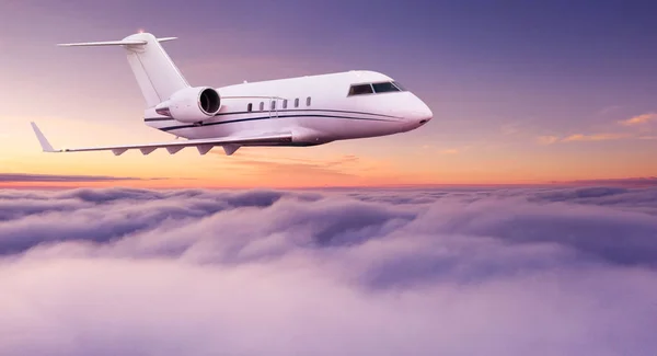 Small private jetplane flying above beautiful clouds. — Stock Photo, Image