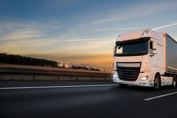 Truck with container on road, cargo transportation concept.