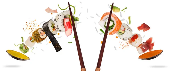 Pieces of delicious japanese sushi frozen in the air. — Stock Photo, Image