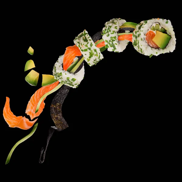 Pieces of delicious japanese sushi frozen in the air. — Stock Photo, Image