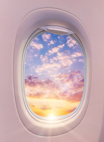 Beautiful sunset with cloudy sky from the airplane window. — Stock Photo, Image