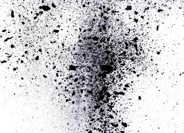 Black powder explosion on black background.