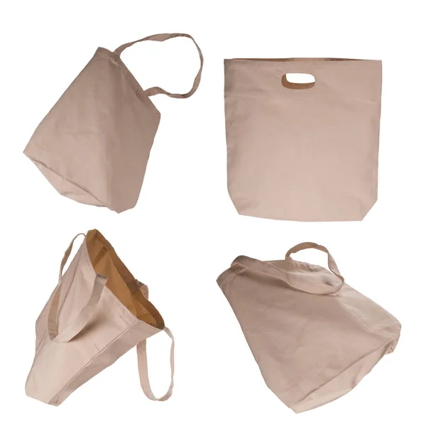 Collection of light beige cotton bags on white background. — Stock Photo, Image