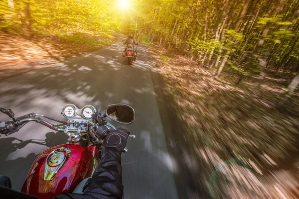 Motorcycle driver riding in spring forest. — Stock Photo, Image