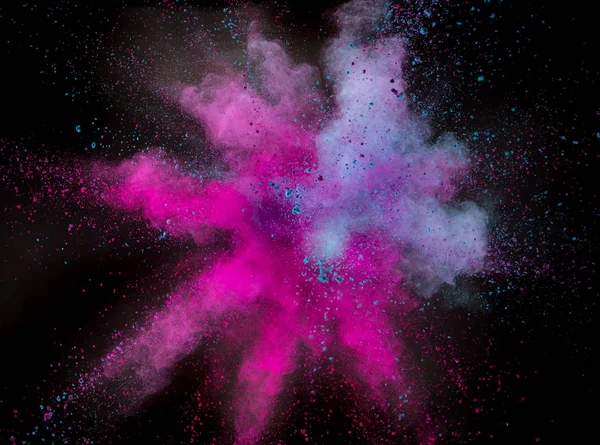 Colored powder explosion on black background. — Stock Photo, Image