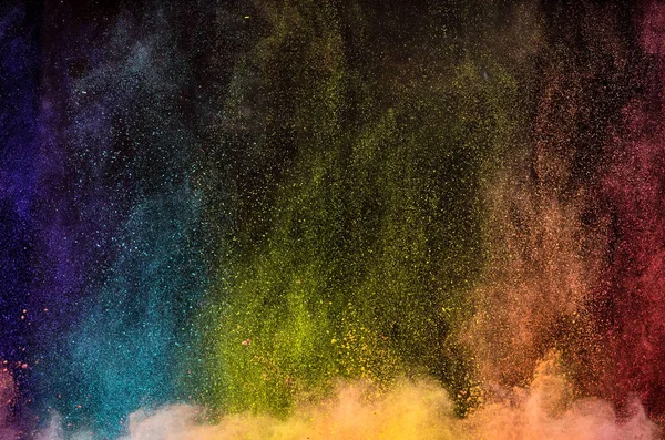 Esplosione di polvere colorata su sfondo nero. — Foto Stock