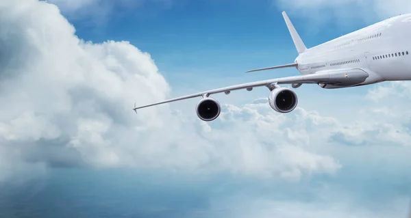 Huge two-storey passengers commercial airplane flying above dramatic clouds. — Stock Photo, Image