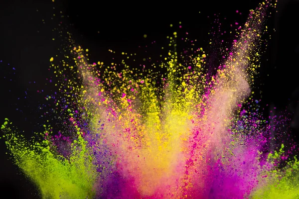 Colored powder explosion on black background. — Stock Photo, Image