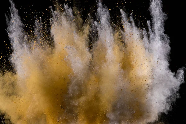 Explosión de polvo dorado sobre fondo negro . —  Fotos de Stock