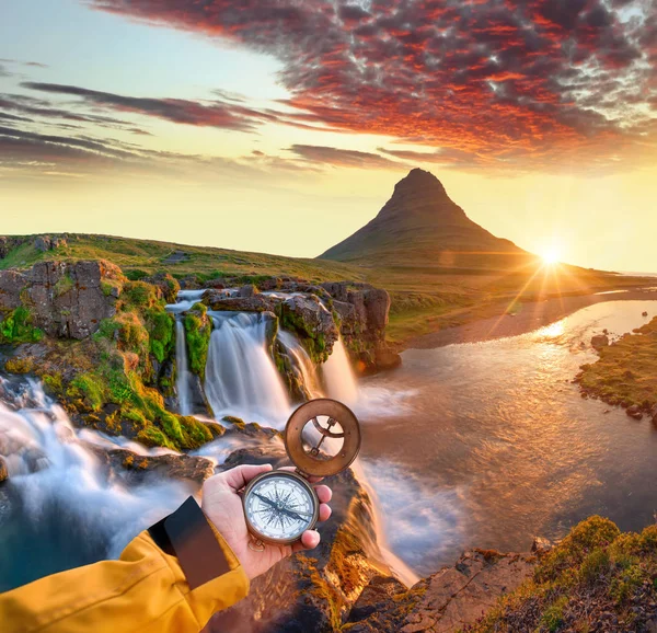 Beautiful landscape with old compass on travelers hand. — Stock Photo, Image