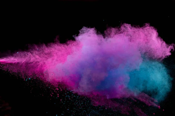 Värillinen jauhe räjähdys mustalla pohjalla. — kuvapankkivalokuva