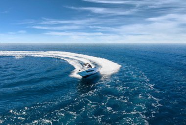 Speed boat in mediterranean sea, aerial view clipart